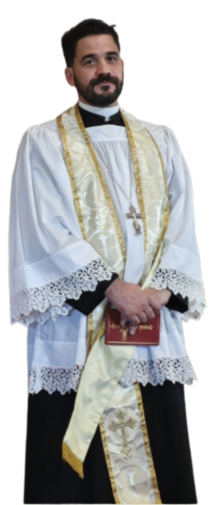 Fr. Gabriel Souza standing with a prayer book in his hands