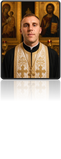 Father Miljan Mitic standing before two Orthodox icons, wearing black and white vestments with gold embroidery.
